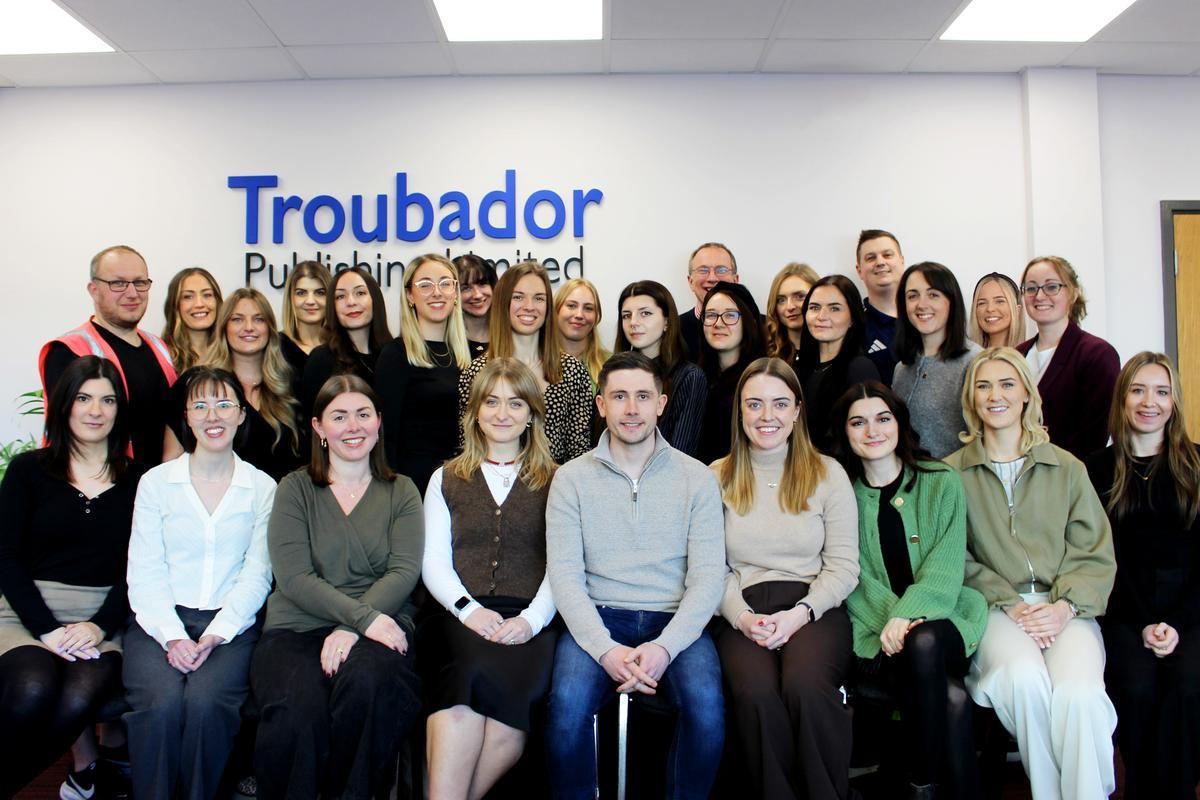 Team photo of staff smiling