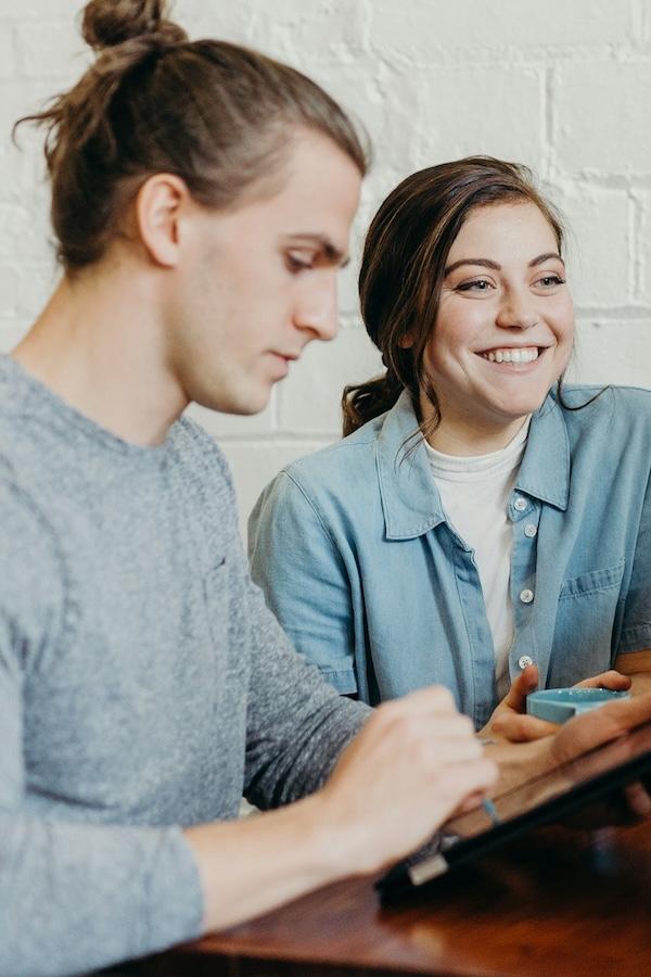 Team photo with man and woman smiling