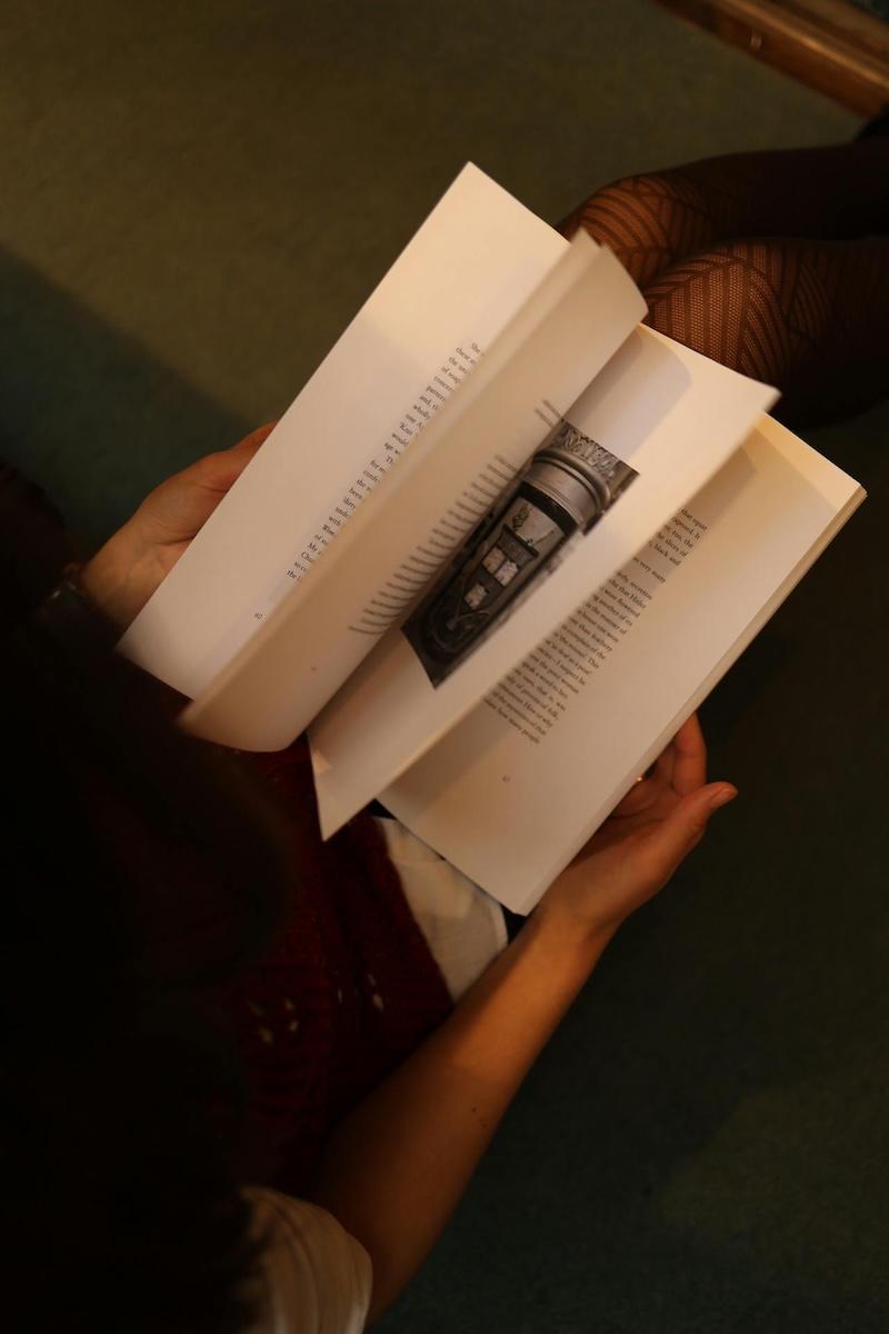 Birds eye view of someone holding an open book