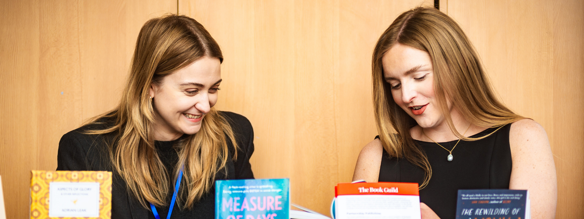 Two women talking and smiling